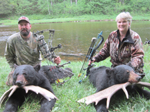 Husband- wife team, Joe and Terri tag bears at Taxis River Outfitters