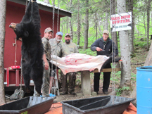 Jeremy, Dale and hunters cutting up bears
