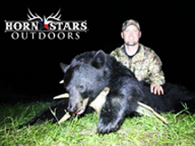 Chris from Horn Stars Outdoors tags another bear in New Brunswick