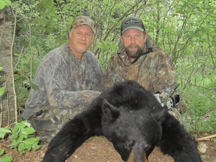 Barry and guide from taxis river outfitters show off their black bear