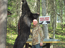Seanâ€™s second bear hunt bags 340 lb black bear at Taxis River Outfitters